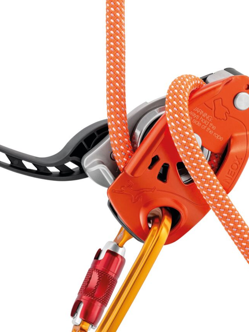 Petzl Neox Assisted Breaking Belay Device - on belay - The Climbing Shop